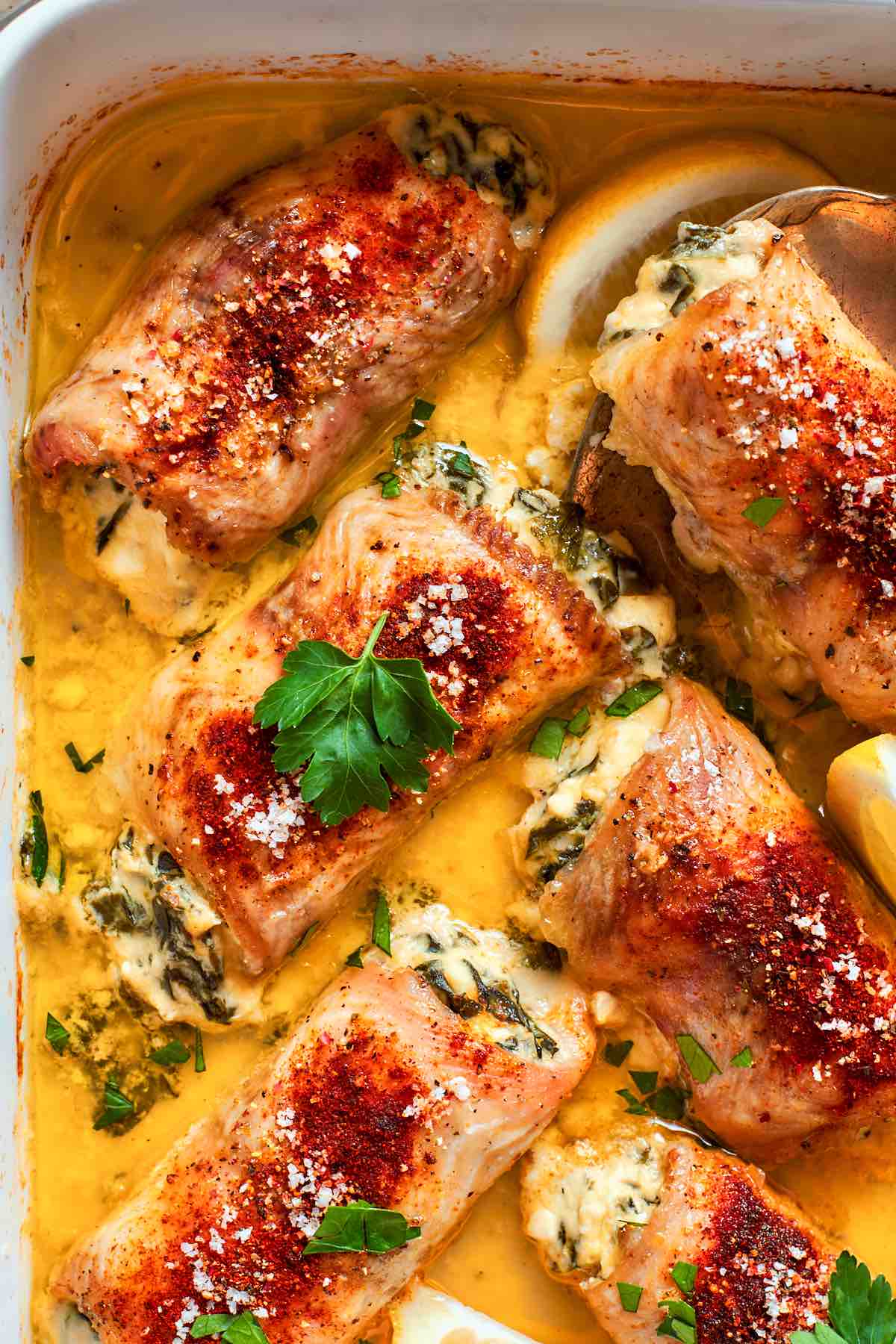 cheesy stuffed flounder in a baking dish.